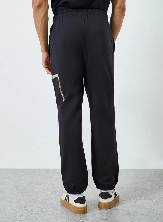 Styli Black Men Black Graphic Print Slim Fit Joggers for Men | Best Price UAE